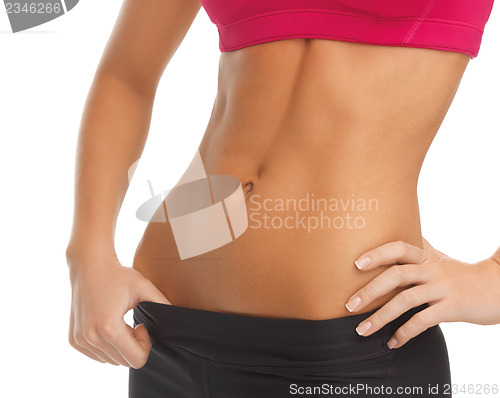 Image of woman trained abs