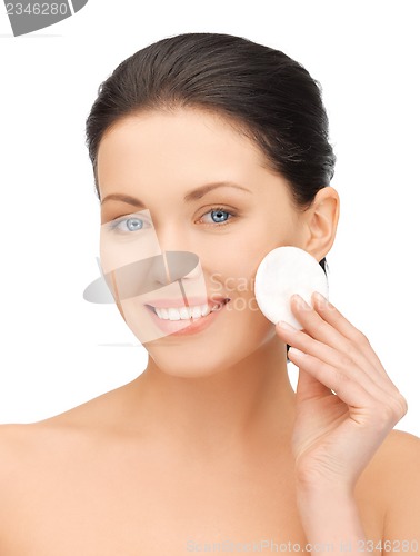 Image of beautiful woman with cotton pad