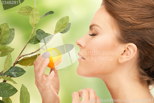 Image of lovely woman with lemon twig