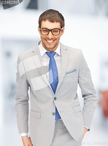 Image of happy businessman in spectacles