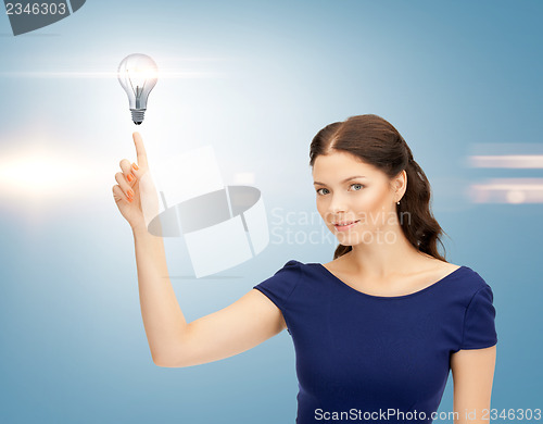 Image of woman pointing her finger at light bulb
