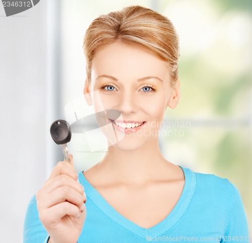 Image of happy woman with car key