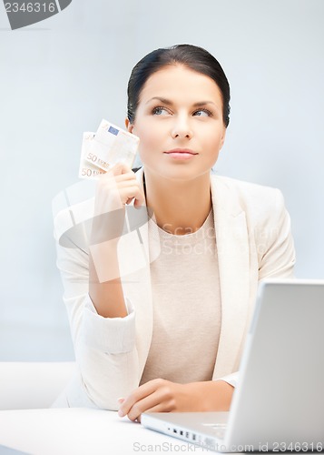 Image of businesswoman with cash money