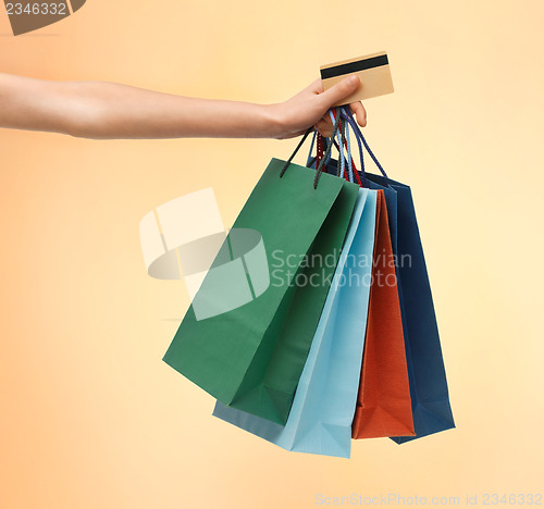 Image of multi colored shopping bags and credit card