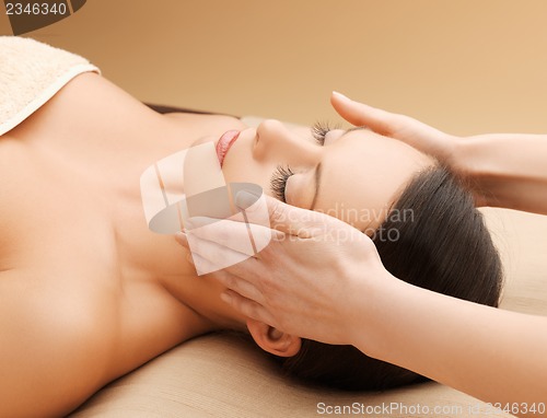 Image of beautiful woman in massage salon