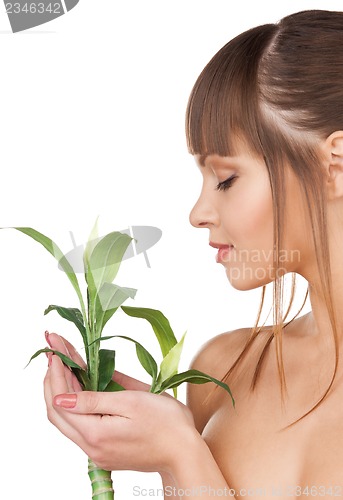 Image of woman with green sprout
