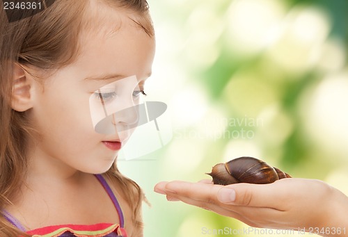 Image of litle girl with snail