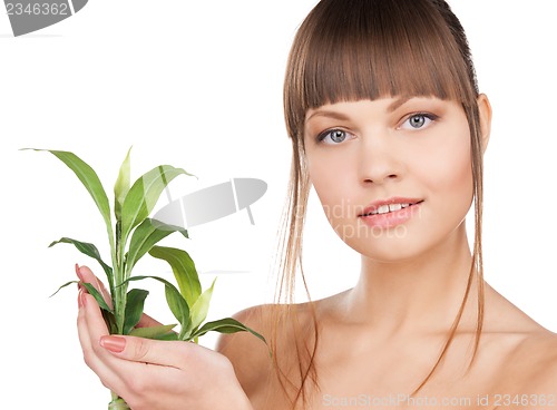 Image of woman with green sprout