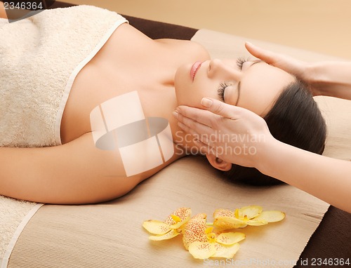 Image of beautiful woman in massage salon