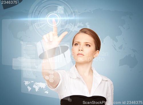 Image of businesswoman touching virtual screen