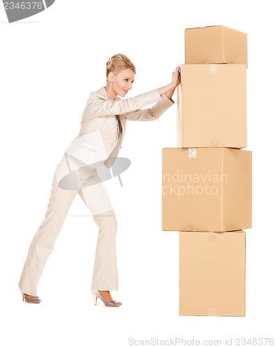 Image of businesswoman with big boxes