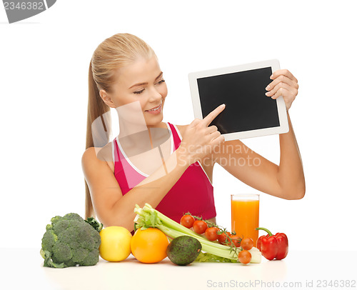 Image of woman with fruits, vegetables and tablet pc