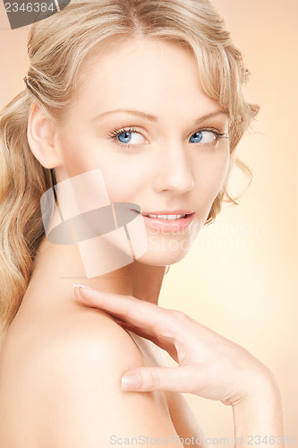 Image of face and hands of beautiful woman