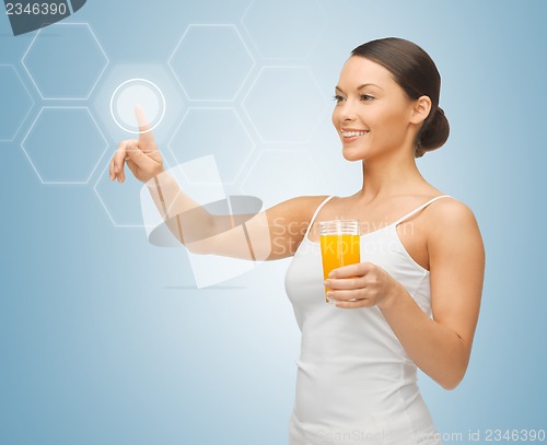 Image of woman with glass of juice and virtual screen