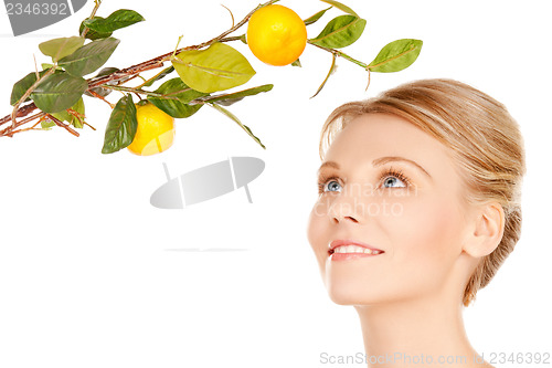 Image of woman with lemon twig