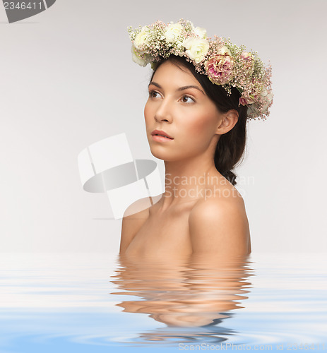 Image of woman wearing wreath of flowers