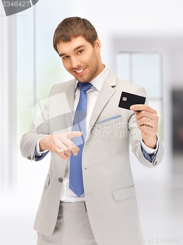 Image of businessman with credit card