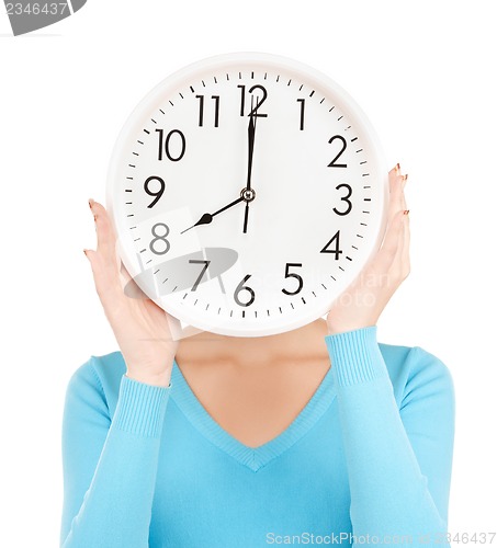 Image of businesswoman with clock over her face