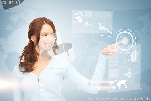 Image of businesswoman touching virtual screen