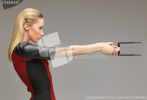 Image of futuristic woman with gadget