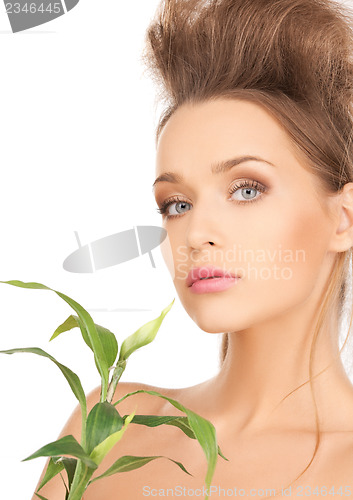 Image of woman with green sprout
