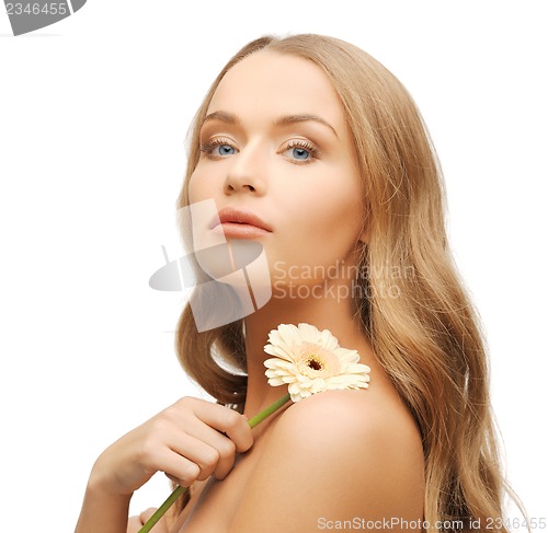 Image of lovely woman with gerbera flower