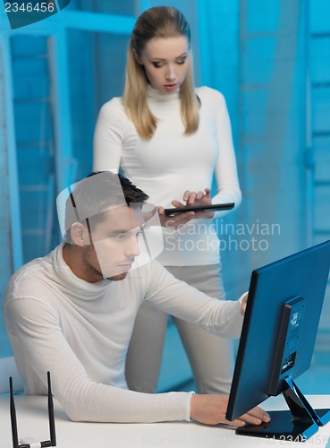 Image of man and woman in laboratory