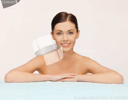 Image of beautiful woman with towel