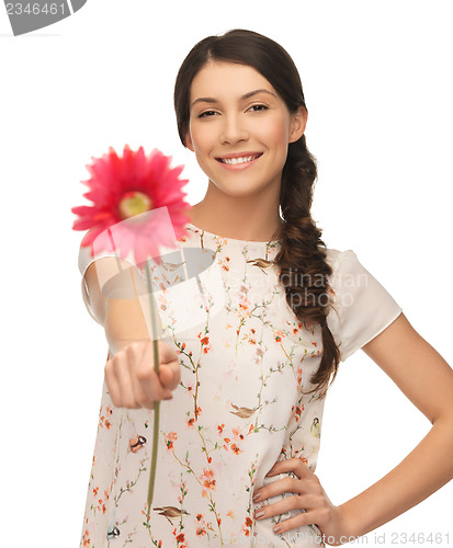 Image of young and beautiful woman with flower