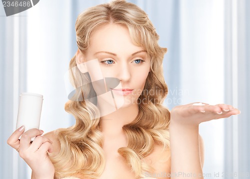 Image of young woman with pills