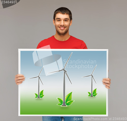 Image of man with picture of wind turbines