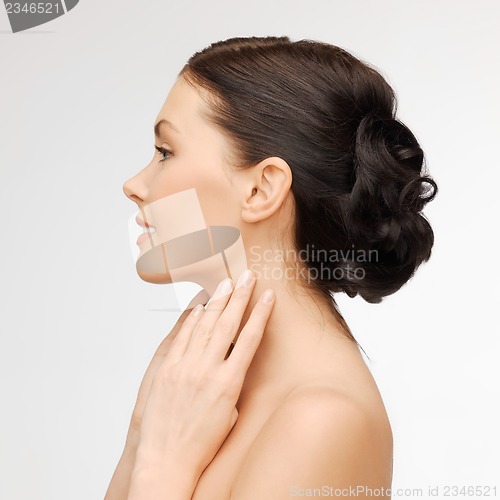Image of face and hands of beautiful woman