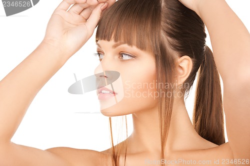 Image of face and hands of beautiful woman