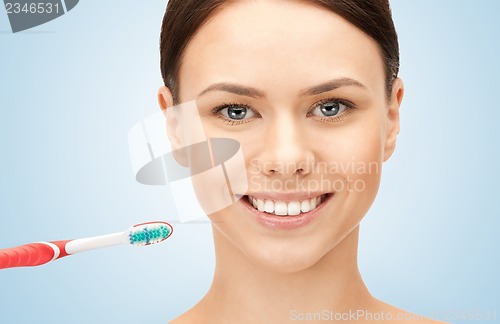 Image of beautiful woman with toothbrush