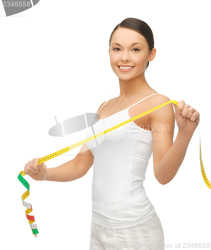 Image of sporty woman with measuring tape