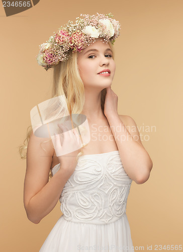 Image of woman wearing wreath of flowers