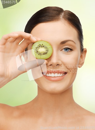 Image of woman with kiwi slice