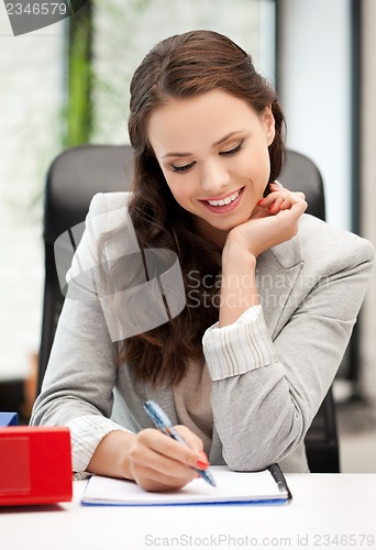 Image of happy woman with documents