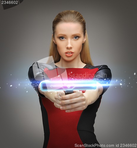 Image of futuristic woman with gadget