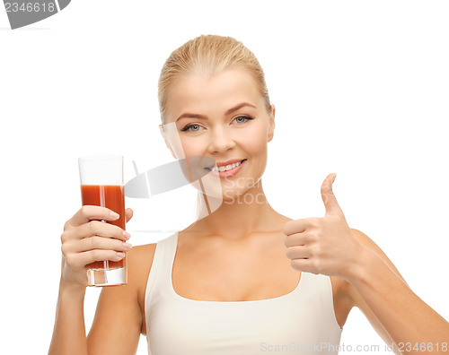 Image of woman holding glass of tomato juice