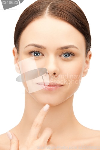 Image of woman touching her chin