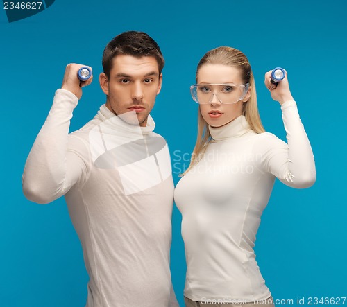 Image of man and woman with pocket flashlights