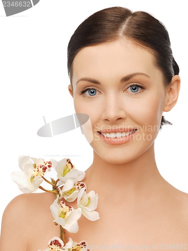 Image of lovely woman with orchid flower