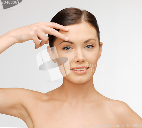 Image of face and hands of beautiful woman