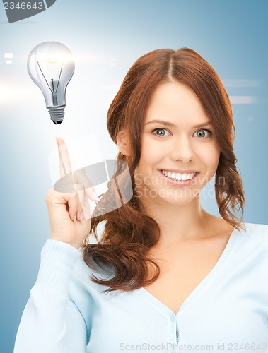 Image of woman pointing her finger at light bulb