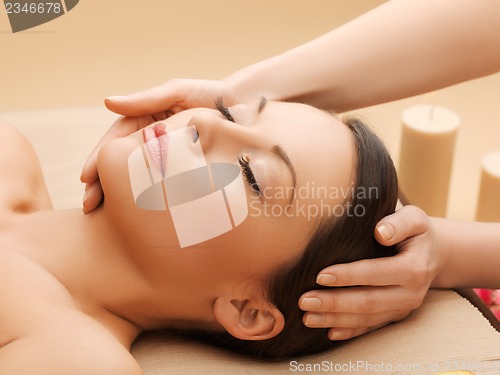 Image of beautiful woman in massage salon