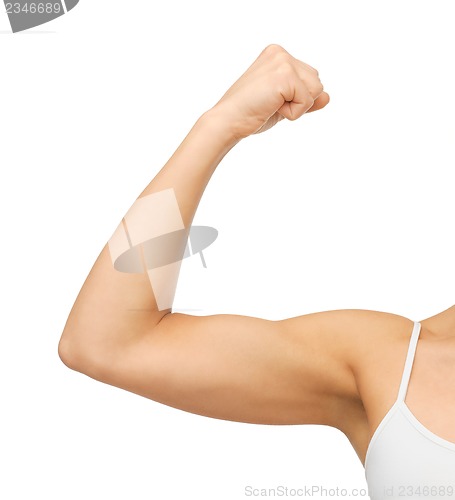 Image of sporty woman flexing her biceps