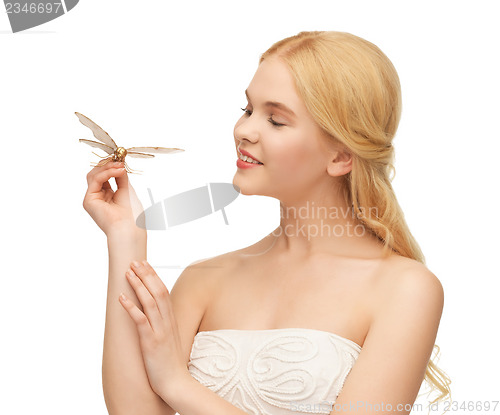 Image of woman with butterfly in hand