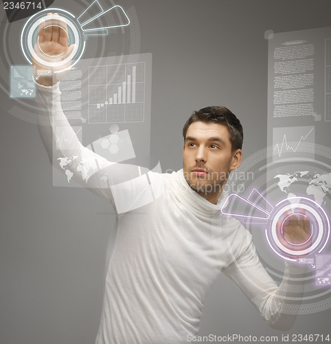 Image of man working with virtual screens