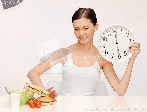 Image of woman with big clock